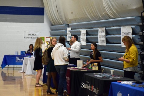 Students talking to colleges during the College Fair