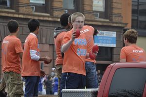 Junior Jack Livingston throwing out footballs during the parade 