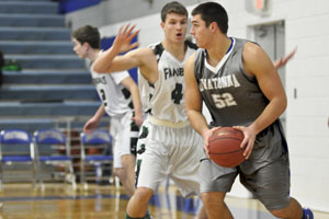 Senior Andrew Stelter passes the ball up court