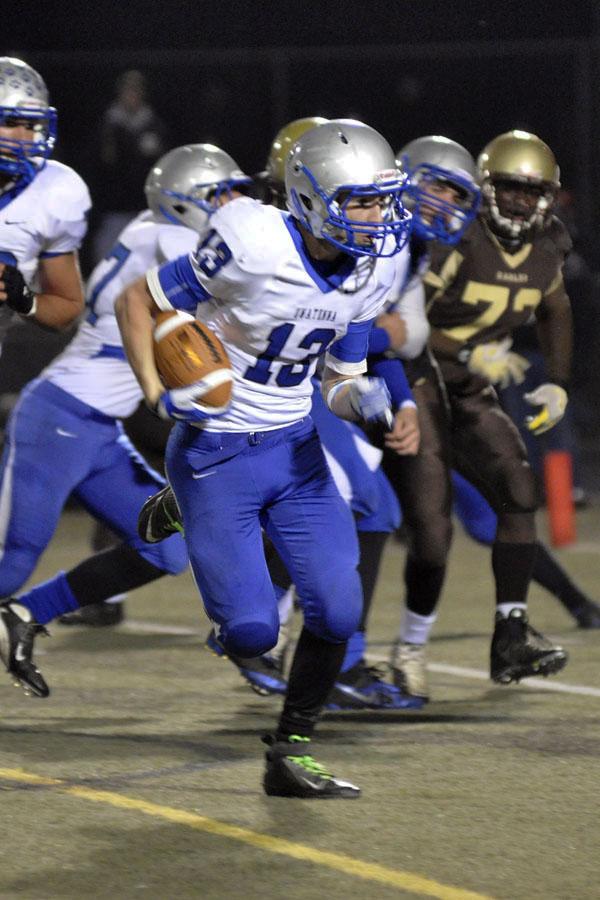 Aaron Peterson runs the ball in the state quarter-final game against Apple Valley