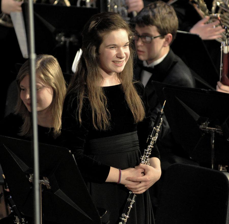 Junior Kayla Moothart smiles at the crowd at the end of a song last Thursday night