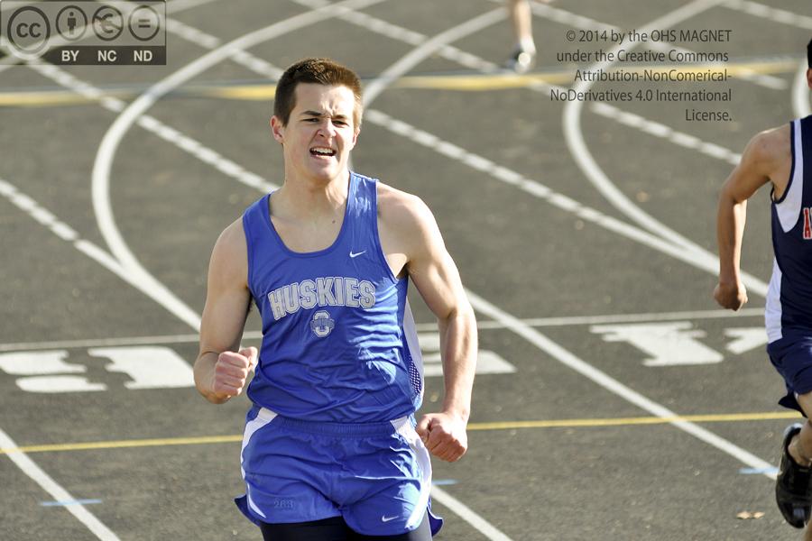 Martin Gleason puts forth his best effort as he runs down the last stretch of track