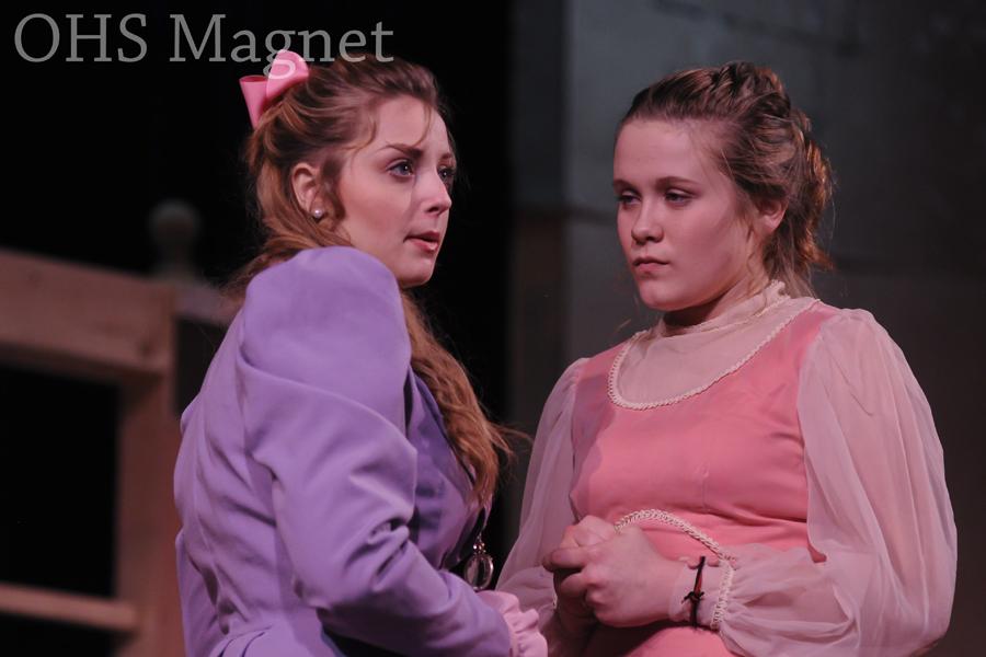 Cecily Cardew (Avery Oja) finds a new friend turned enemy turned sister in Gwendolen Fairfax (Jessica Friedman)