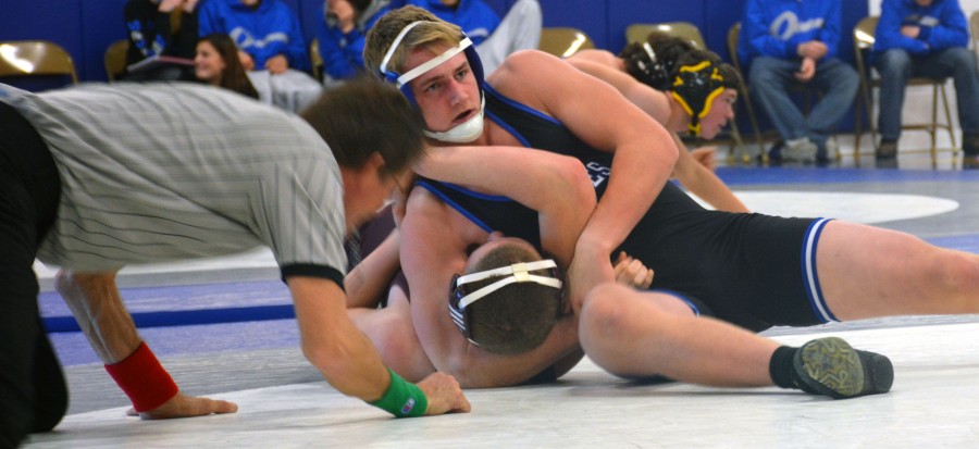 Griffin Thorn, sophomore, pinning his opponent from Northfield