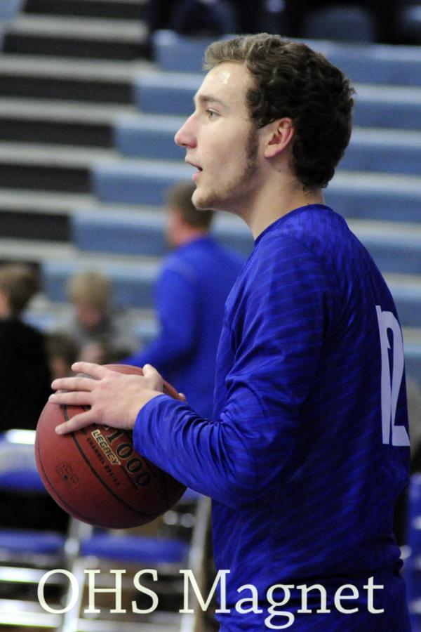Jacob Neuharth gets ready to pass the ball in warm ups