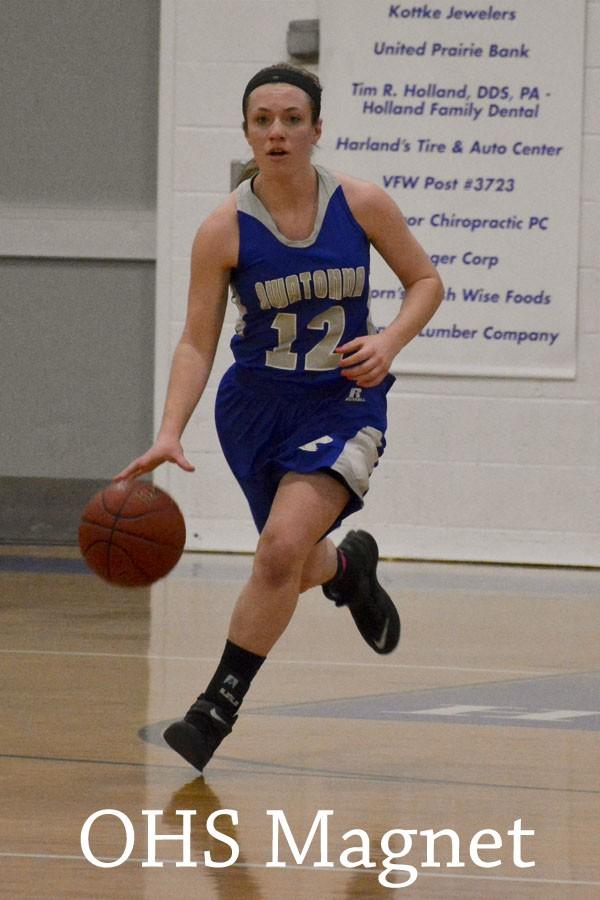 Kirstin Pumper brings the ball down the court after taking it from her opponents 