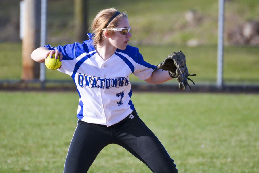 Second baseman Ellie Rohman throws the ball to the first baseman