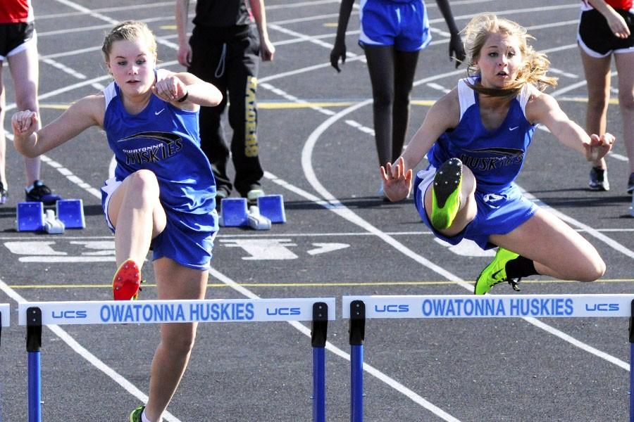 Taylor Velzke and McKenzie Sommers hurdles at the first home meet