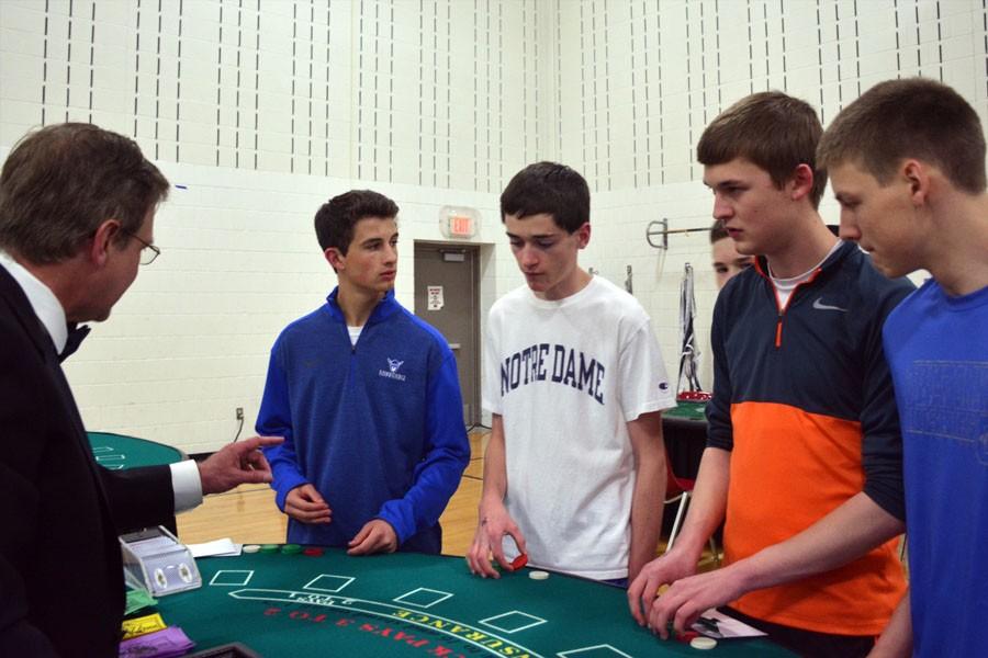 Juniors Mitchell Haberman, Luke Holzerland, Joseph Belina and Senior Matthew Deetz putting up their bets for gambling