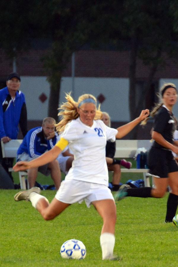 Senior Arianna Olson kicks the ball