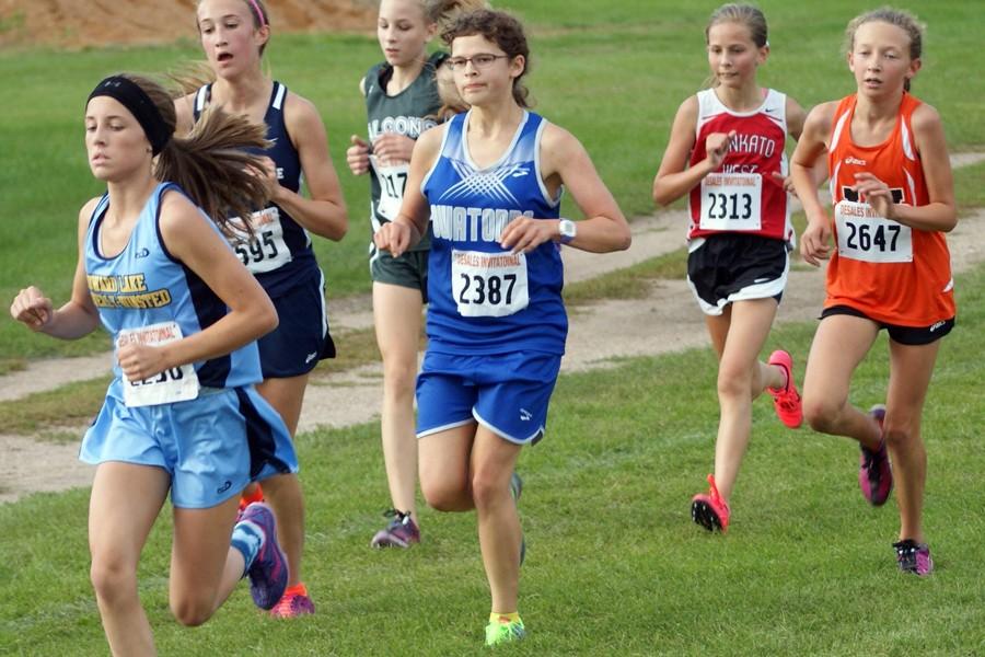 Junior Sarah Wall races along side her competitors 