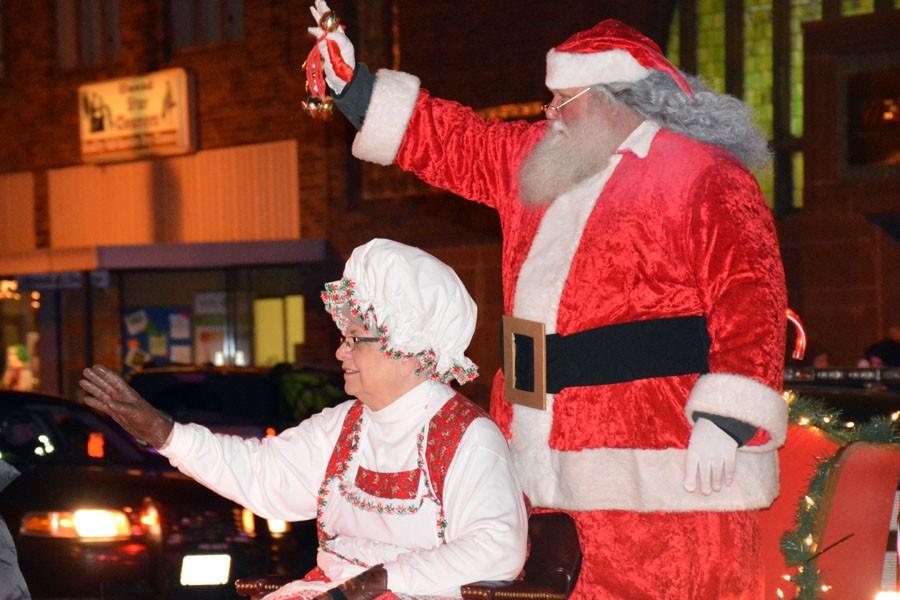 Santa and Mrs. Claus waving to the crowd 