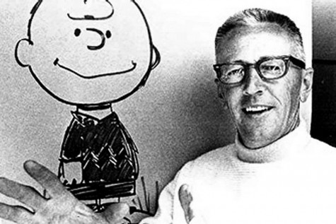 Minnesota native and Peanut's creator Charles Schultz with an original Charlie Brown drawing