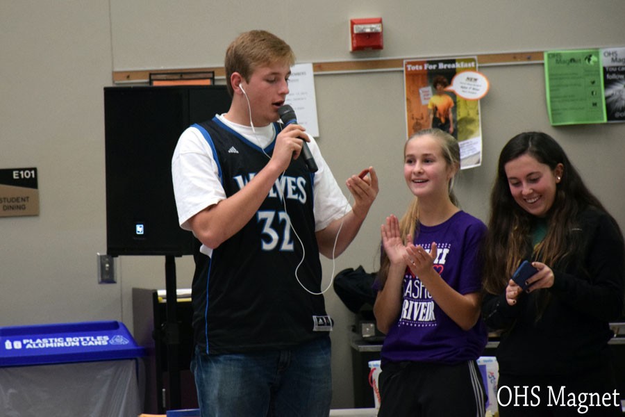 Senior Eli Havelka participating in the singing activity during lunch