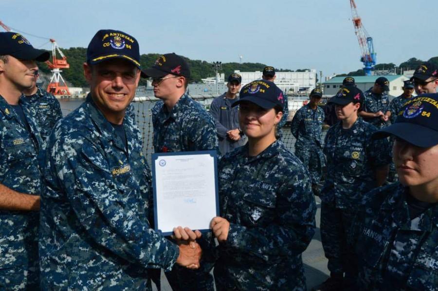 OHS 2014 Alum Shadie Brooks receiving an award in the Navy