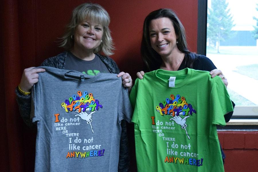 Mrs. Margo McKay and Mrs. Nancy Williams display pre-race t-shirts for the From the Heart Run