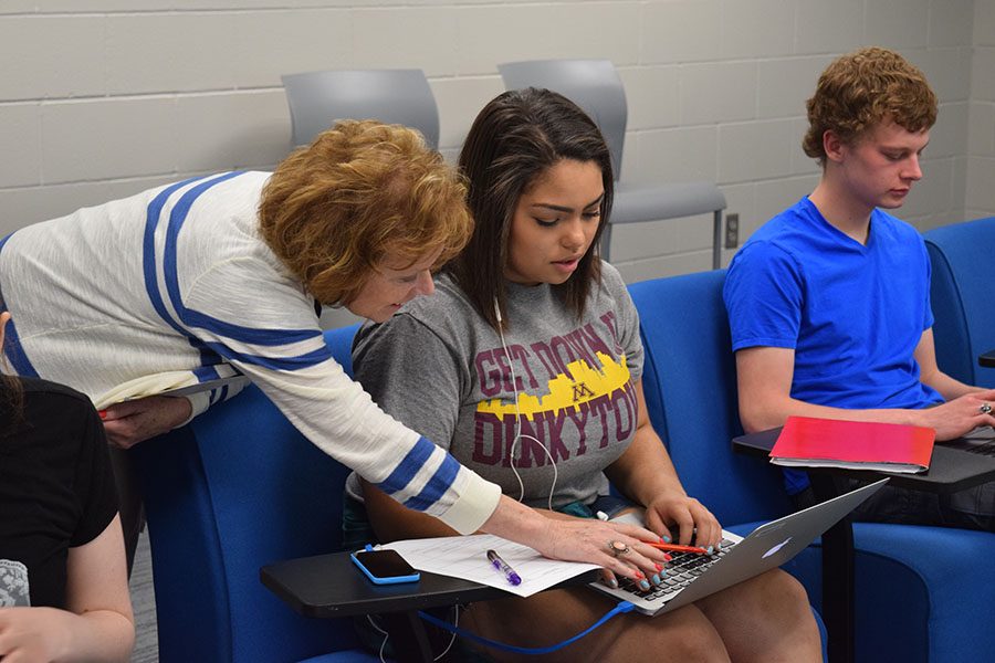 Mrs. Val Rose works with senior Kiana Smith on her mentorship project