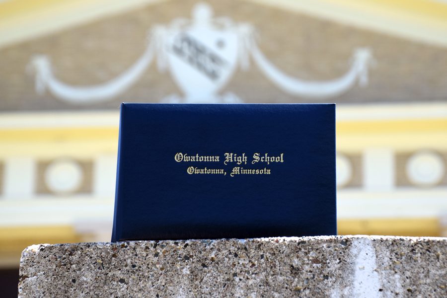 OHS graduates receive their diploma as a sign of the end of high school