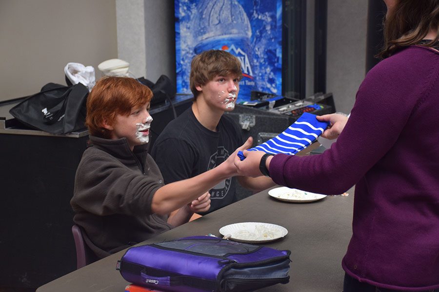 Junior Parker Westphal and Freshmen Phillip Koslosky finish with the whip cream eating contest.