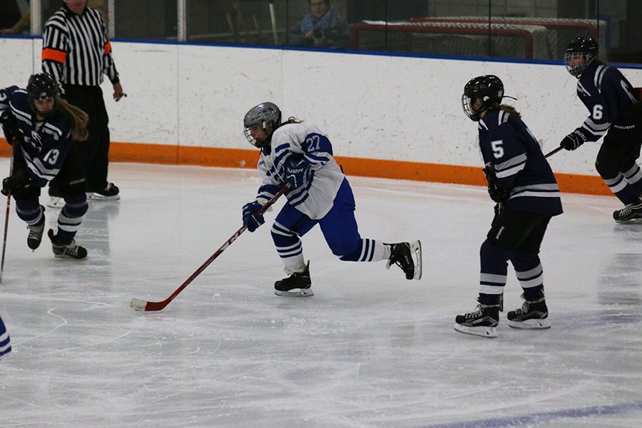 Sophomore Maylynn Prokopec attacks with the puck