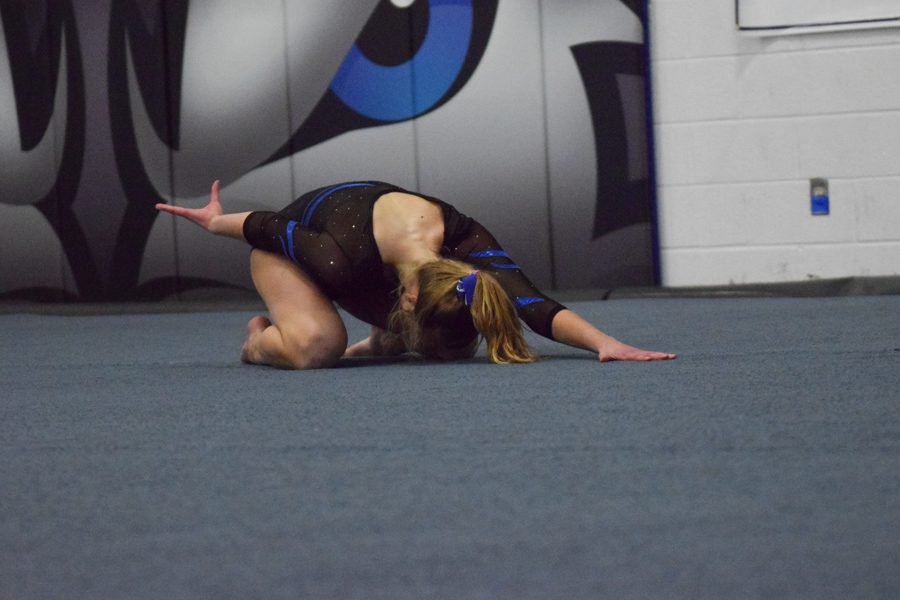 Syd Kretlow poses for the end of her floor routine