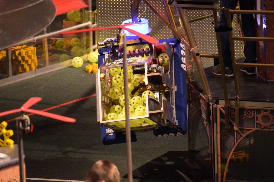 The Owatonna 4624 robot climbs the "airship"