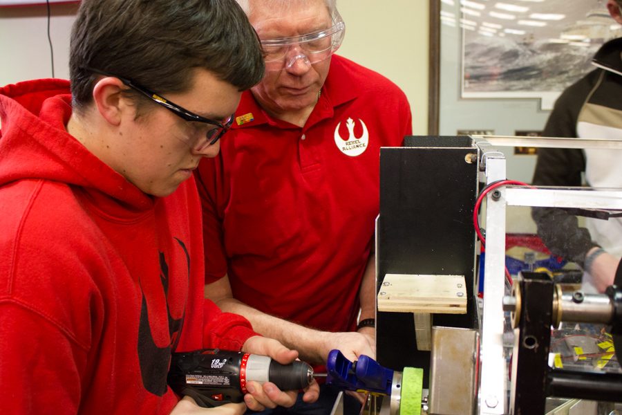 Max Liedtke drills with the assistance of Mentor Larry Chaldek