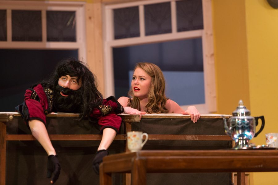 Tito and Maggie are interrupted behind the couch
(Nick Hagen and Greta Jacobson) 