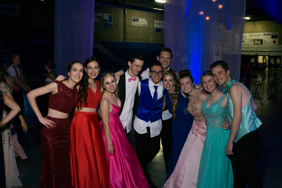 Prom goers pose for a photo