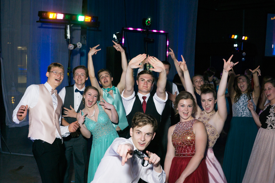Prom goers pose for a photo