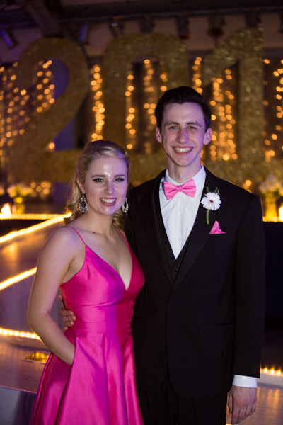 Senior Jenna McMains and 
 junior Nick Hagen pose in front of the stage