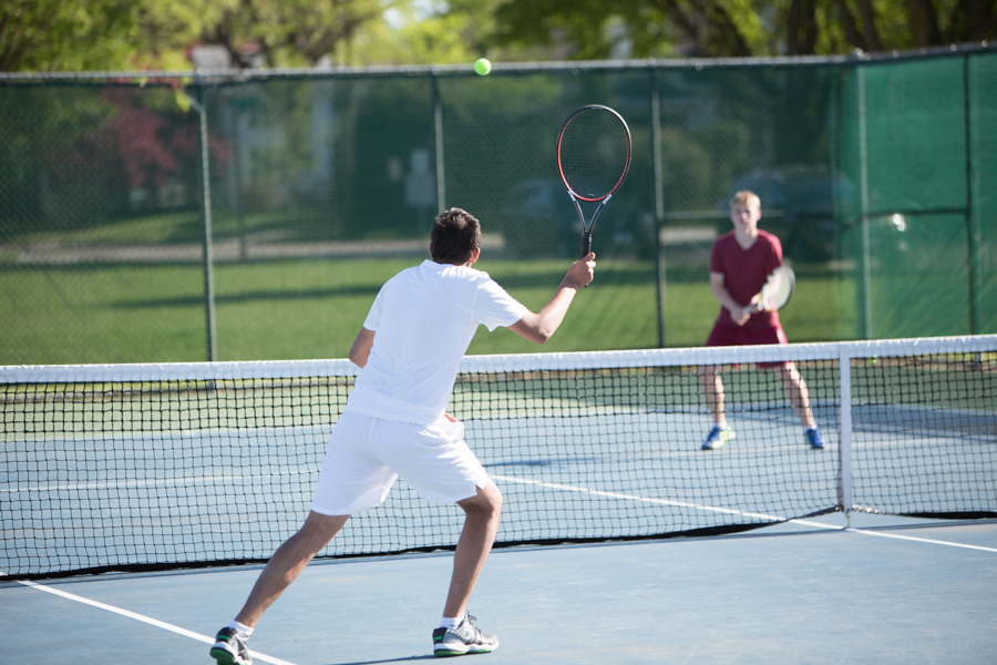 Aqil Lakha volleys at the net