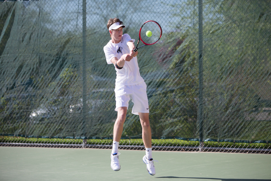 Eden Morozek returns the ball during a singles match