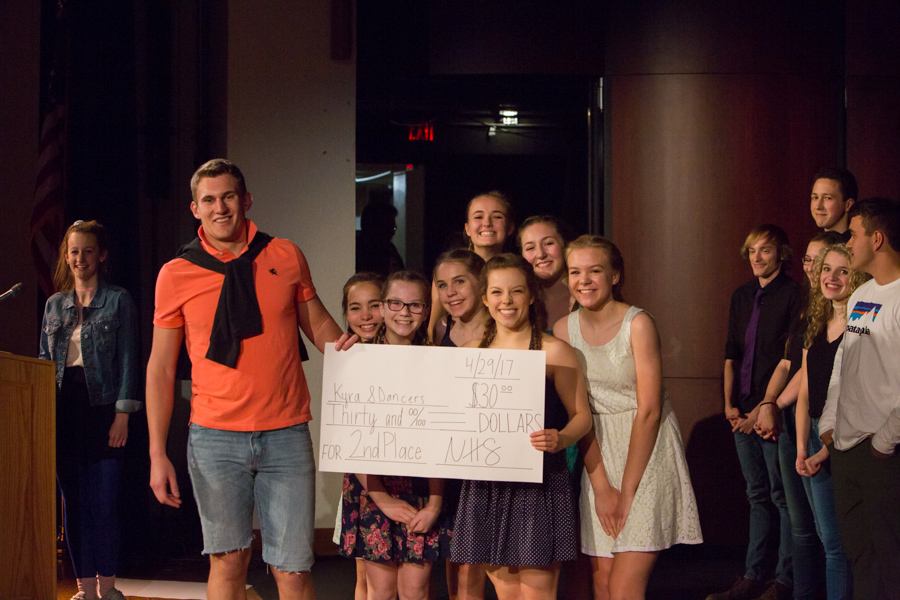 2nd Place Winners Kyra Rahn and her dance team pose with MCs Ethan Dekam and Tori Urch