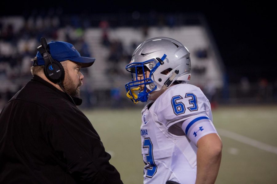 Coach Marc Wiese talks to Sophomore Zach Wiese