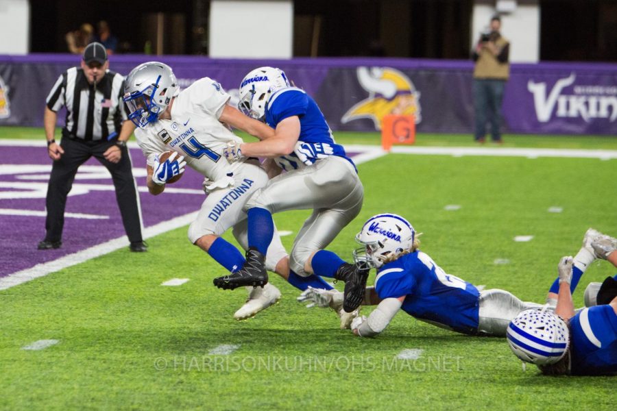 Alex Raichle evades Brainerd defenders for a touchdown 