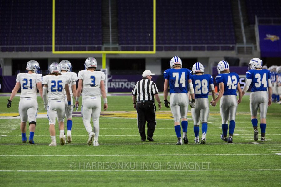 Captains meet for a handshake before the game