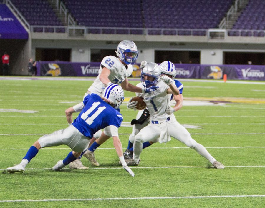 Senior Noah Budach works to make a move on the defense