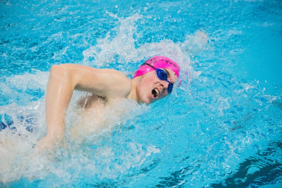 Senior Spencer Steckelberg swim in the 100 freestyle