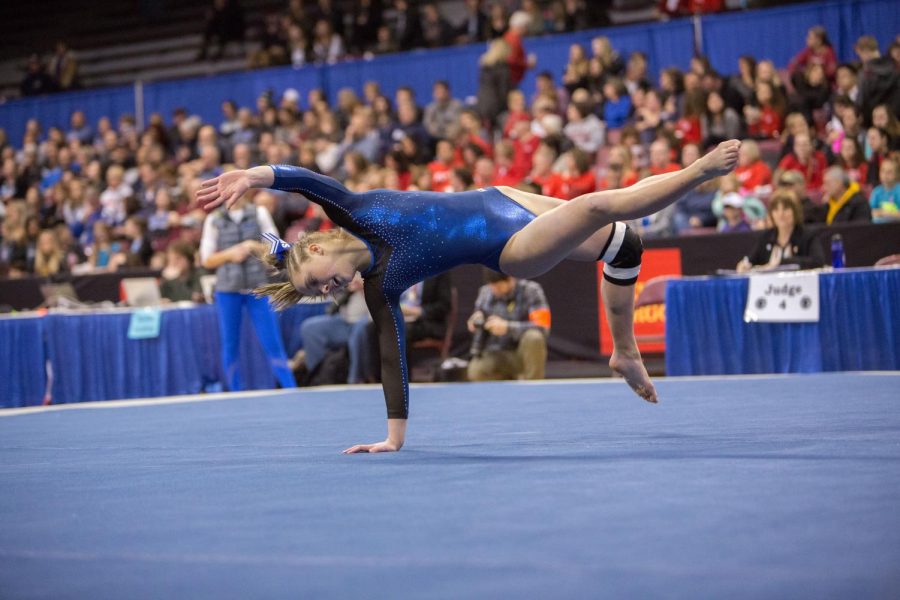 As a freshman Lindsay Bangs performs floor routine at State.  Next year Bangs will go to Gustavus.