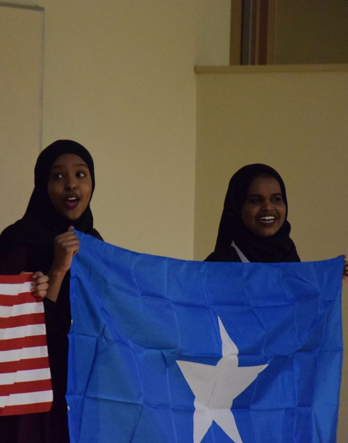 Presenters holding up Somali Flag.