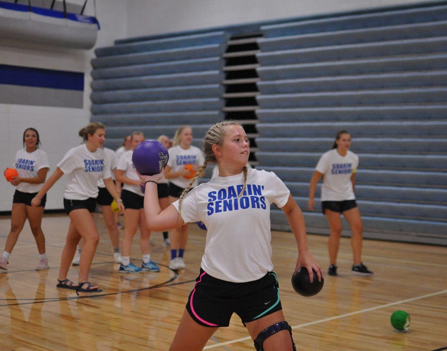 Senior Cassondra Bremer loads her arm back for a throw at the opposing team