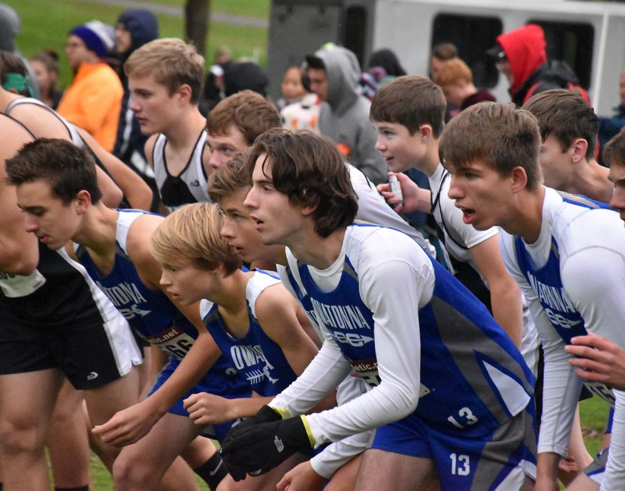 The varsity Cross Country team waiting for the horn 