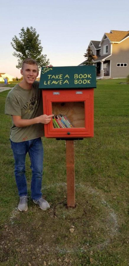 Dallas Wetzel  with his Little Free Library for his Eagle Scout Service Project