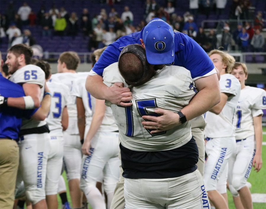 Chris Lewis lifts up Coach Johnson in celebration after the title game. Lewis will appear at the All-State Game on Saturday, Dec. 15
