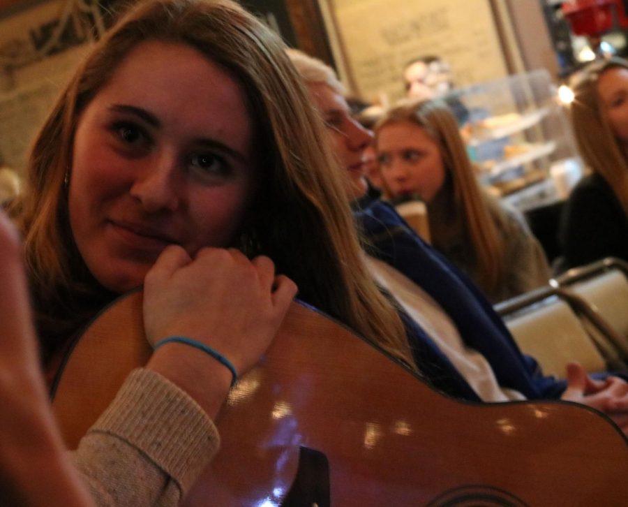 Kaia Elstad smiles with her guitar 