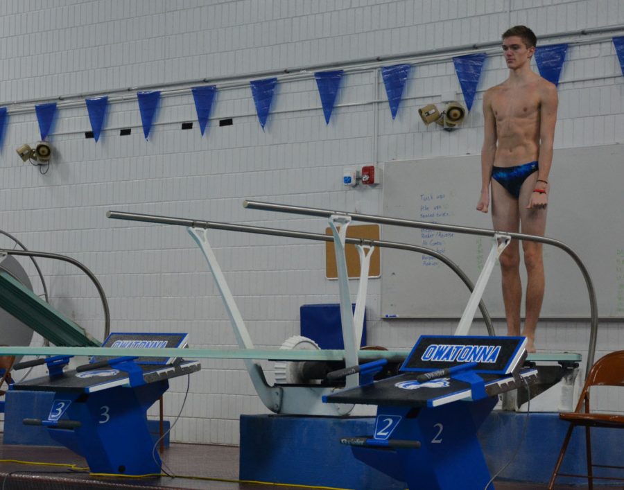 Junior Colten Kamholz prepares to dive 