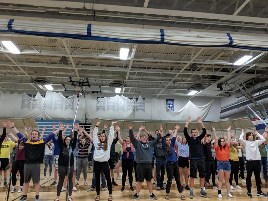 OHS Concert Choir practices their choreography for the Pop Concert in the gymnasium.