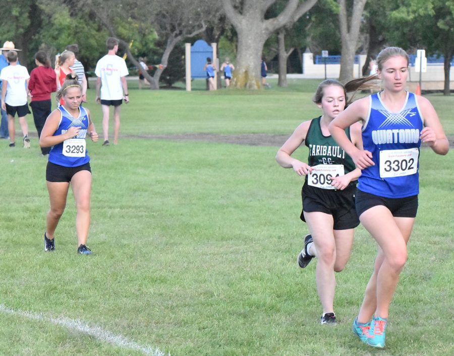 Sophomore+Betsy+Wunderlich+and+Senior+Chloe+Schmidt+running+during+the+Faribault+race