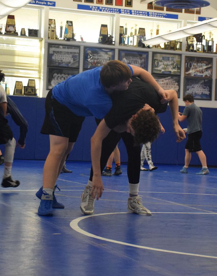 Junior Matt Seykora and Junior Landon Johnson at wrestling practice.